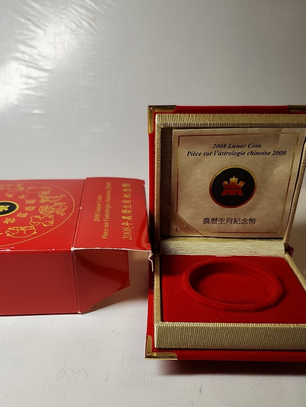 2008s Red Lunar Coin Presentation Case with Gold Accents